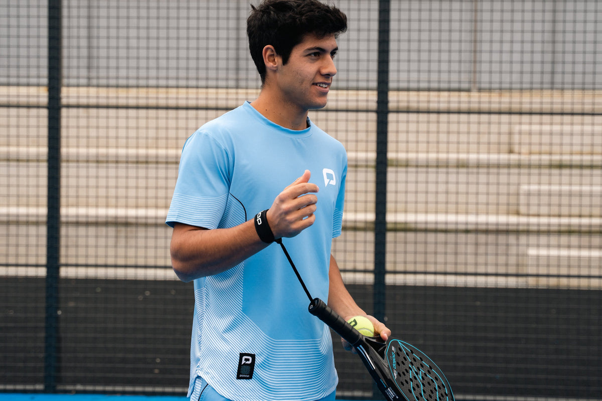 Padel player gripping a Pallap racket handle on court