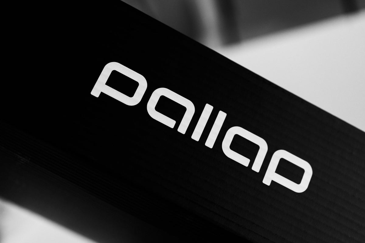 Carbon fibre detail on a Pallap padel racket frame