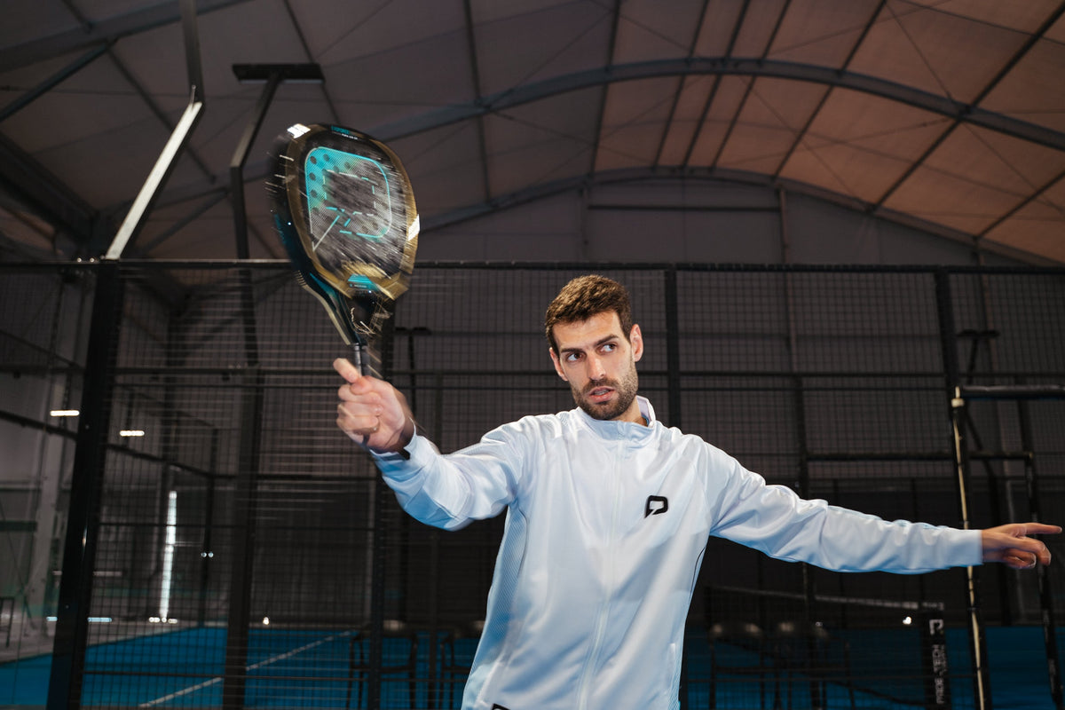 Player hitting an overhead with the Pallap EvoFORCE Dark Star padel racket