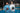 Two men in Pallap padel jackets holding rackets on an indoor court