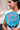 Woman holding a Pallap padel racket on court