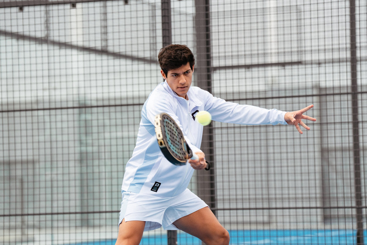 Padel player hitting a forehand with a Pallap racket
